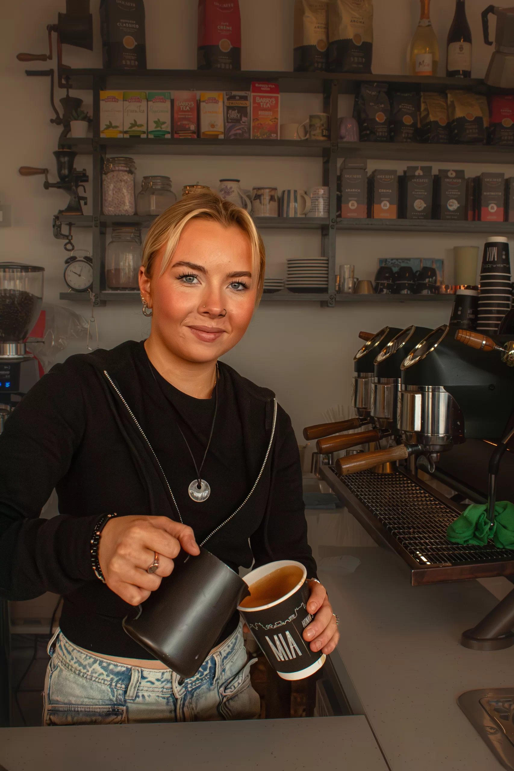 Barista at Oahu Café smiling for the camera