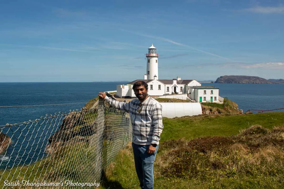 Fanad Lighthouse against a backdrop of cliffs
